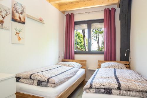 Säng eller sängar i ett rum på Landhaus Schnorrenberg, Wellness & Nature