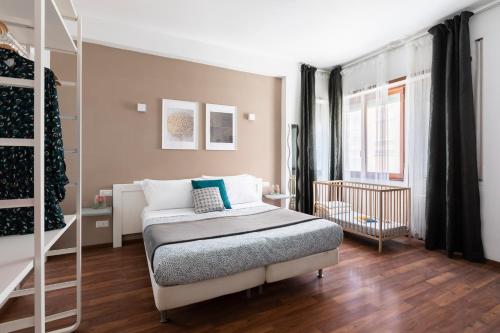 Voodi või voodid majutusasutuse Momo Central Rome 3 toas