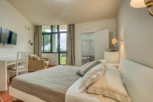 Postel nebo postele na pokoji v ubytování Hotel Villa De Santis