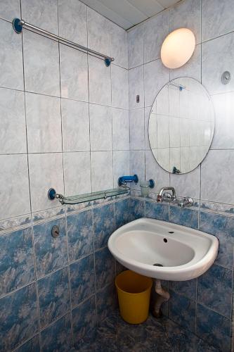 a bathroom with a sink and a mirror at Familly hotel Randevu in Kranevo