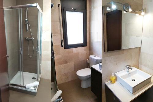 a bathroom with a sink and a shower and a toilet at Apartaments La Farga Arbúcies in Arbúcies