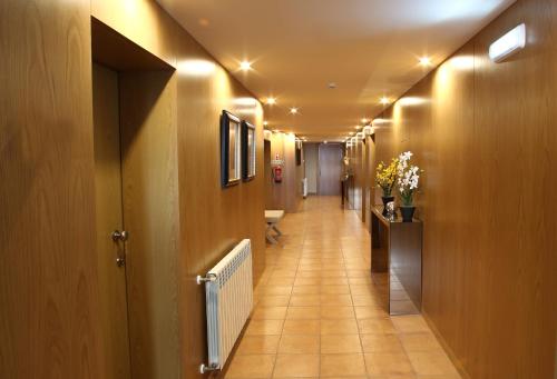 a hallway with a long corridor with a hallway at Paraiso Douro in Lamego