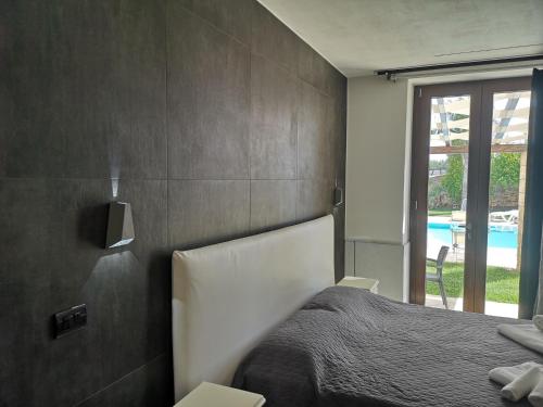 Ένα ή περισσότερα κρεβάτια σε δωμάτιο στο Casale Salento