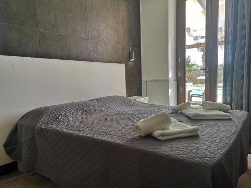 Ένα ή περισσότερα κρεβάτια σε δωμάτιο στο Casale Salento