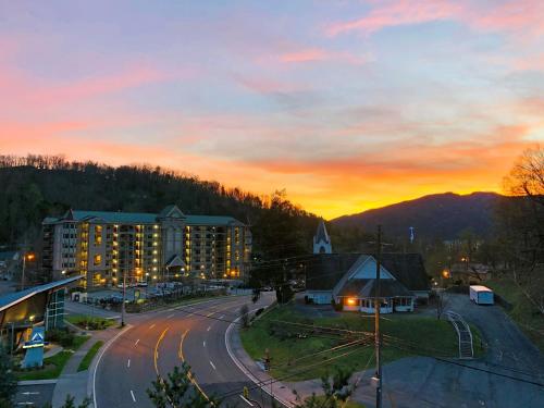 a view of a city with a sunset in the background at Gatlinburg View Lodge in Gatlinburg