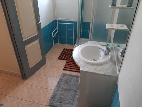 a bathroom with a sink and a shower at Sweety Bounty in Sainte-Luce