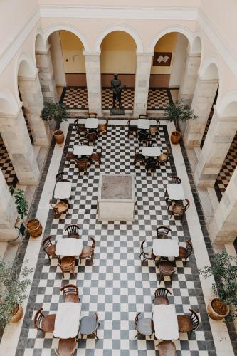 an overhead view of a room with tables and chairs at 5 Hermoupolis Concept Sites in Ermoupoli