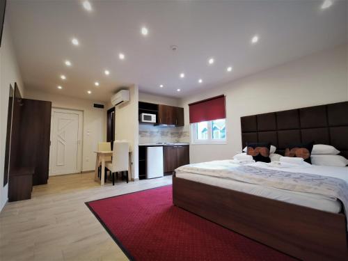 A bed or beds in a room at Termál Apartmanház