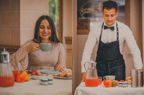 a man and a woman in a kitchen preparing food at Hotel Des Reves in SantʼElia Fiumerapido