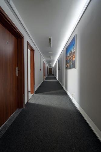a hallway with a long corridor in a building at Noclegi Stop and Sleep Zgorzelec in Zgorzelec