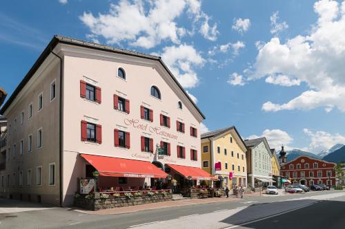 a large white building on a city street at Hotel Heitzmann in Mittersill