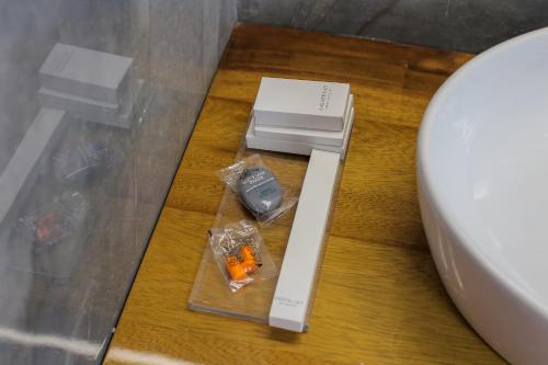 a electronic device on a table next to a toilet at Villa Kristiano 21 in Sarandë