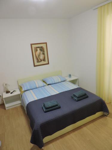 Postel nebo postele na pokoji v ubytování Apartments Lidus