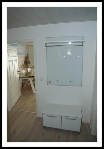 a white room with a white wall and a table at Nordstern in Büdelsdorf