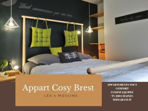 an apartment cosy bedroom with a bed with green pillows at Appart Cosy Brest (Les 4 moulins) in Brest