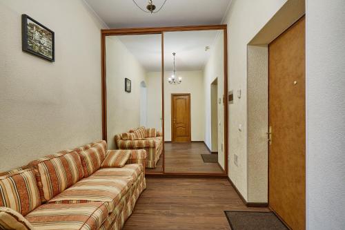 a waiting room with couches and a hallway with a door at Botanic Towers the house has a shelter in Kyiv