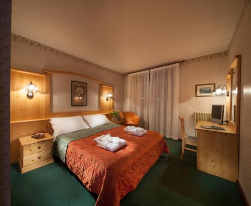 Ένα ή περισσότερα κρεβάτια σε δωμάτιο στο Hotel Miralago Wellness - Adults Only