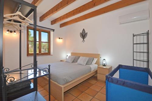 A bed or beds in a room at Villa Calderitx