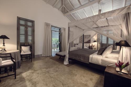 Katil atau katil-katil dalam bilik di Taru Villas Mawella - Tangalle