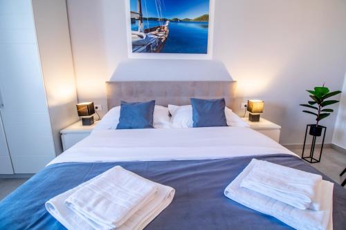 Ένα ή περισσότερα κρεβάτια σε δωμάτιο στο Apartments Vito