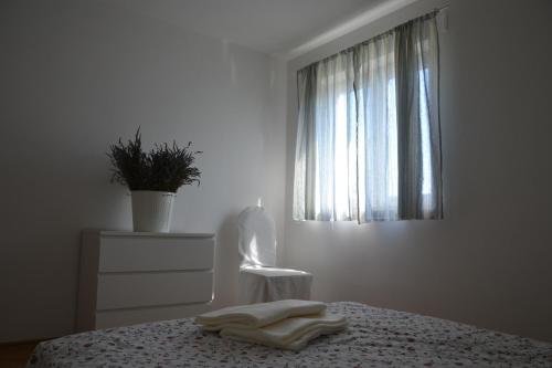 Postel nebo postele na pokoji v ubytování Apartments Roža