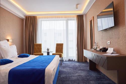 Postel nebo postele na pokoji v ubytování Stavros Hotel