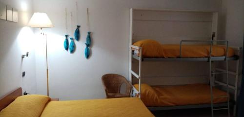 Ein Bett oder Betten in einem Zimmer der Unterkunft Hotel Caporal