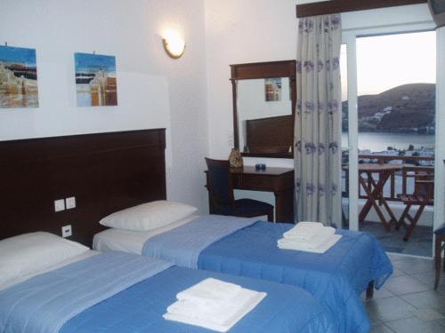 Postel nebo postele na pokoji v ubytování Rita's Place Hotel