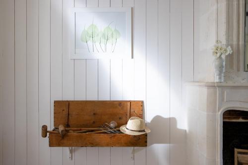 a hat sitting in a wooden box on a wall at Villa Clarisse & Spa by Olivier Claire in Saint-Martin-de-Ré
