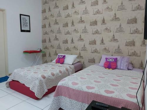 Кровать или кровати в номере Vista Alam Roomstay Homestay