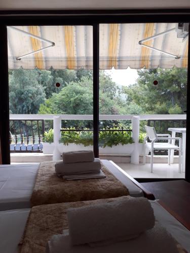 Ένα ή περισσότερα κρεβάτια σε δωμάτιο στο Studios Souropanis