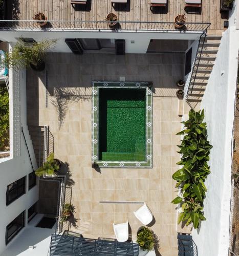 an overhead view of a swimming pool on a building at Casa Mourisca in Silves