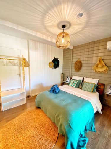 a bedroom with a large bed in a room at Villa Moai 974 in Saint-Leu