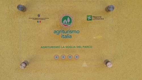 a metal table with a sign on it at Agriturismo La Soglia Del Parco in Ranica