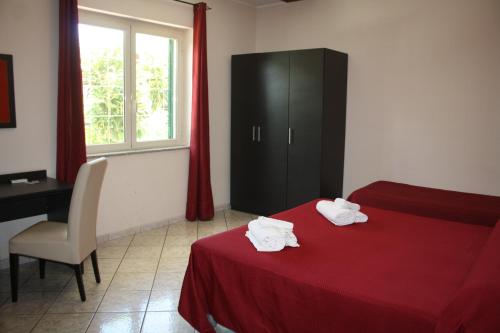 Postel nebo postele na pokoji v ubytování B&B Paradiso