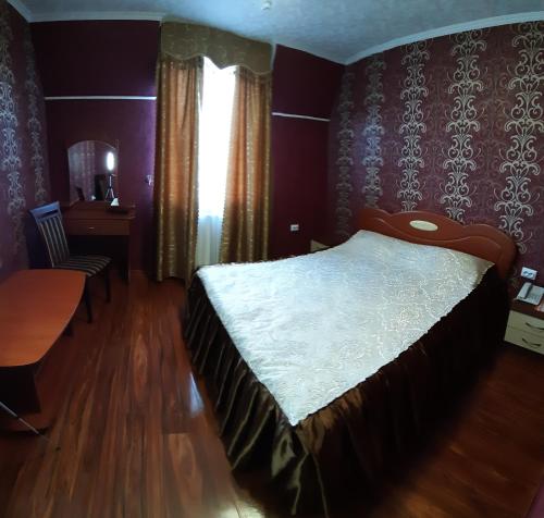 Postel nebo postele na pokoji v ubytování Ідилія