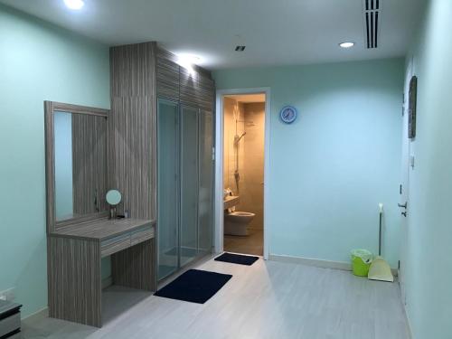a bathroom with a sink and a toilet at KLCC Apartment in Kuala Lumpur