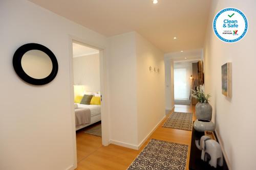 a bedroom with a bed and a mirror on the wall at Enjoy Lisbon Martim Moniz 1 in Lisbon