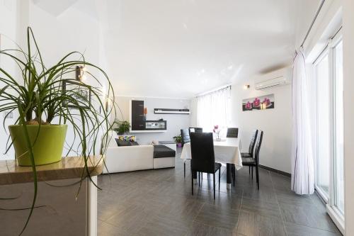 a living room with a table and a couch at Apartment Carmen in Pula