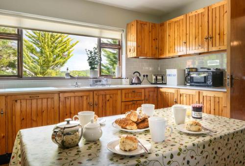 a kitchen with a table with food on it at The Rocks in Westport