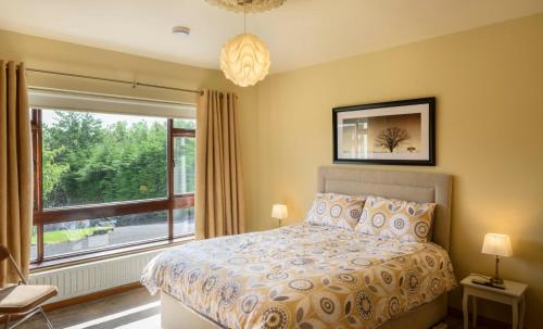 a bedroom with a bed and a large window at The Rocks in Westport