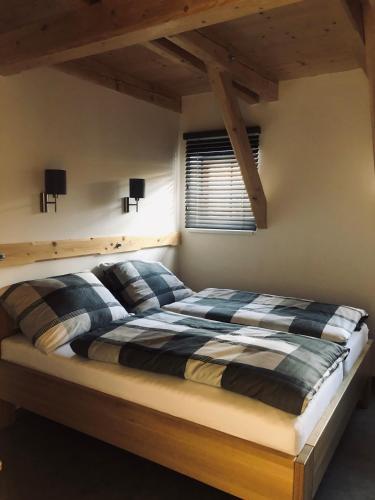 a bedroom with a bed in a room at Kameňácká myslivna in Moravany