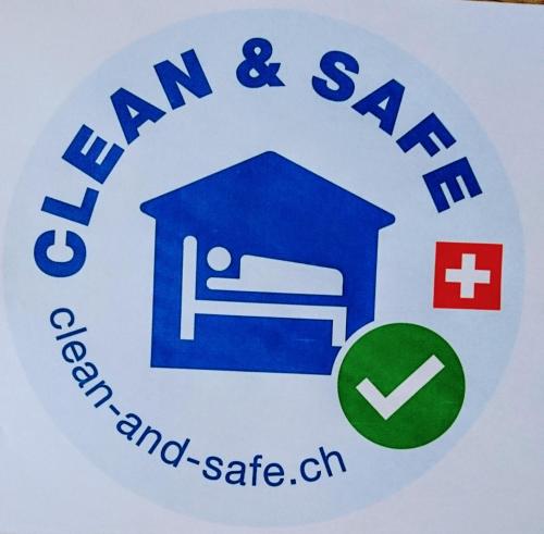 a sign for an am and sa hospital and safe sign at Lehmann's Herberge Hostel in Grindelwald