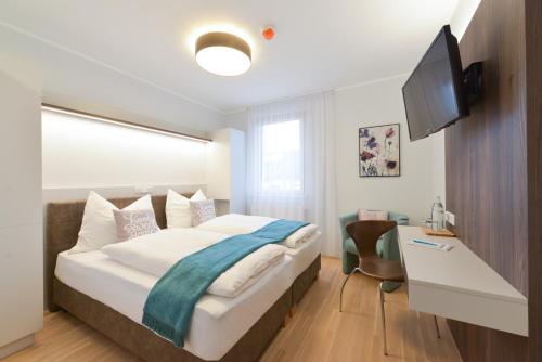 Postel nebo postele na pokoji v ubytování 23-hotel