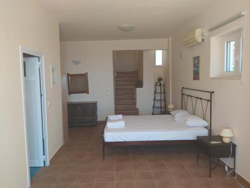 A bed or beds in a room at Neohori 3