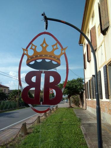 a large sign with a crown on top of it at LA GASTALDIA in Pontecasale