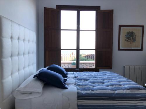 Ένα ή περισσότερα κρεβάτια σε δωμάτιο στο Villa Catalá