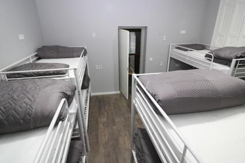 a room with three bunk beds in a room at Madrid Downtown Hostel in Madrid