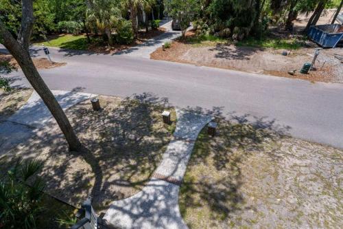 a shadow of a tree on the side of a street at Lloyd's Lodge at Davis Love Dr in Fripp Island