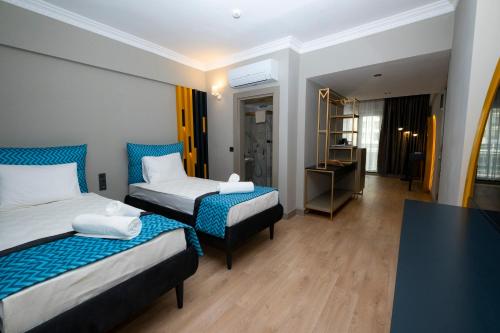 Postel nebo postele na pokoji v ubytování Sea City Devran Hotel & Spa